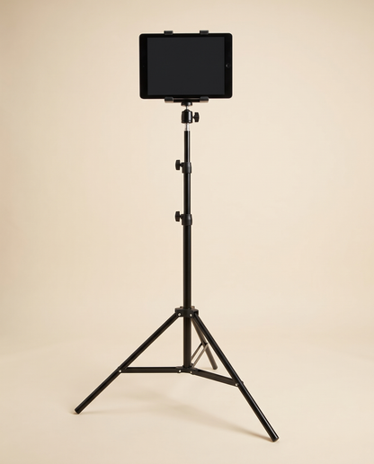 Black tablet floor stand with tripod legs, ball head and tablet clamp holding a tablet