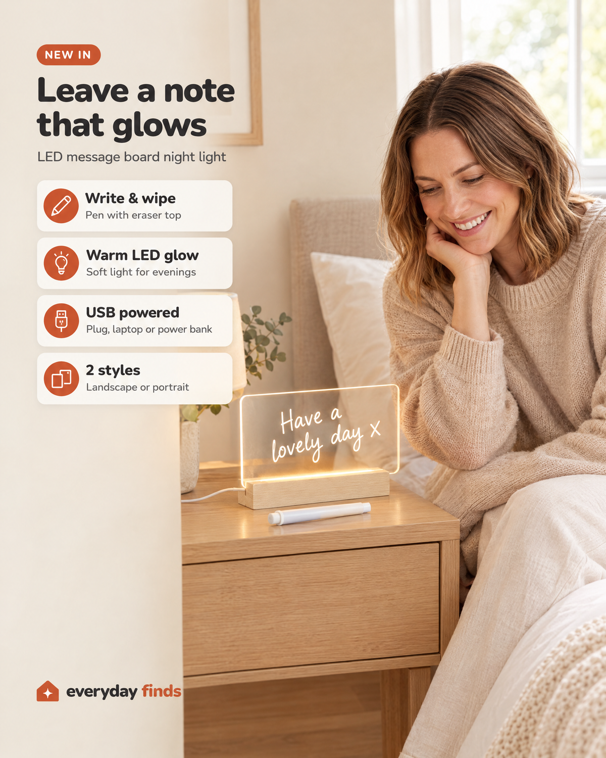 Woman smiling at the LED message board night light on her bedside table, with icons: write & wipe, warm LED glow, USB powered, 2 styles