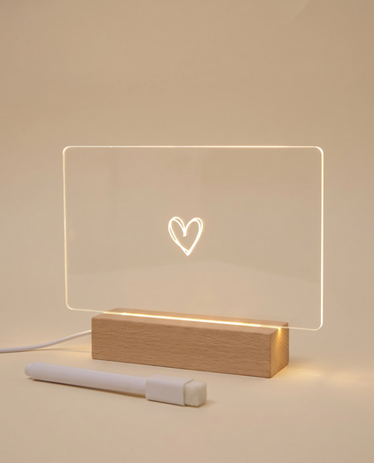 LED message board night light in landscape style with a glowing heart doodle, wood-effect base and white pen
